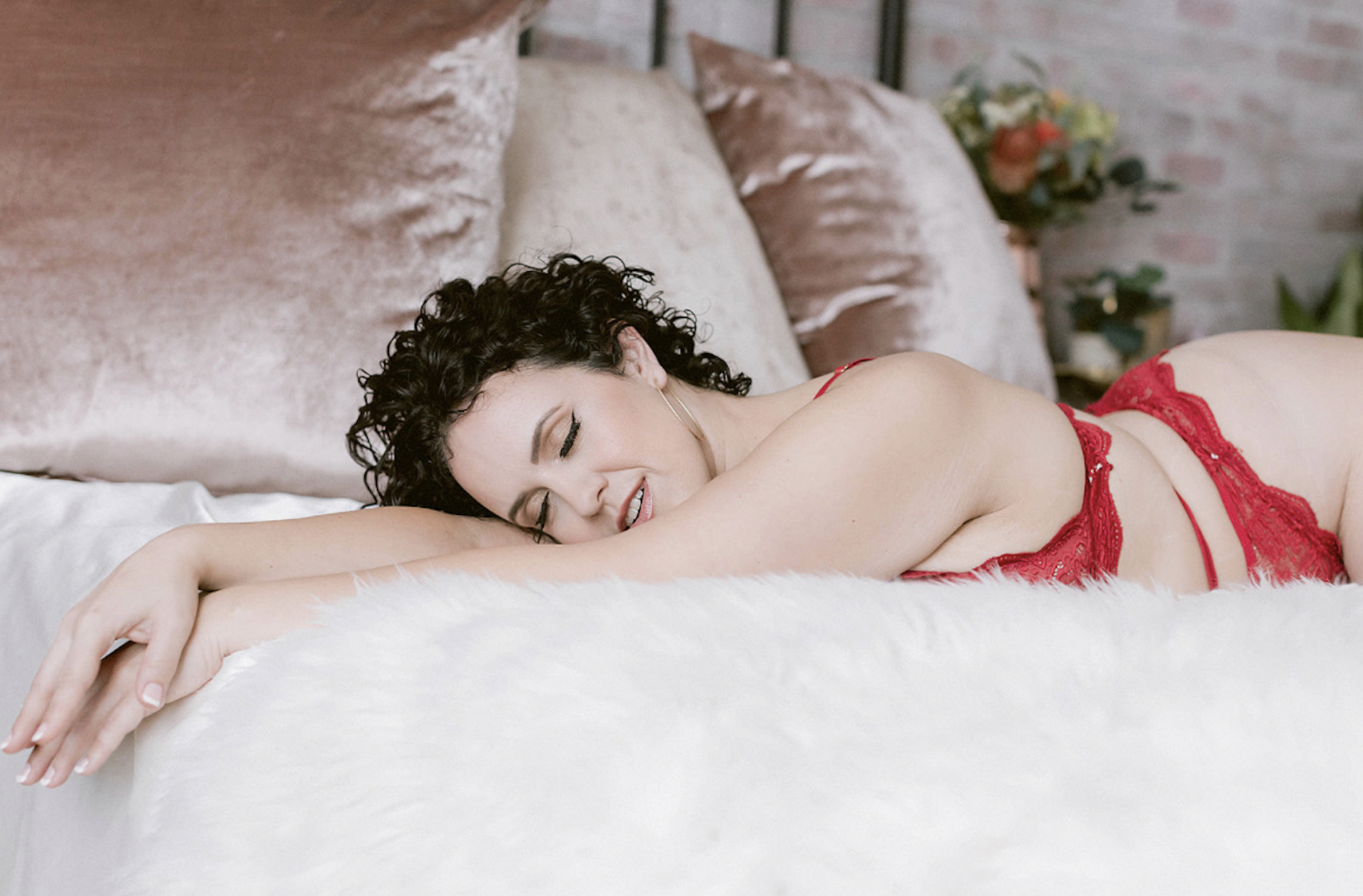 a woman embracing her curly hair for her northern california boudoir photography session